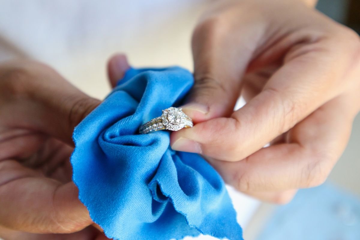 hands cleaning gold ring